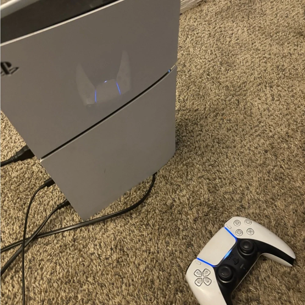 Sony PlayStation Console with White and Black Controller